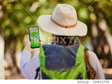 GPS, direction and woman hiking in a forest for exercise, adventure or wellness in nature. Navigation app, phone and female hiker trekking on an outdoor trail in the woods alone with a mobile map. GPS, direction and woman hiking in a forest for exercise, adventure or wellness in nature. Navigation app, phone and female hiker trekking on an outdoor trail in the woods alone with a mobile map. 130612750