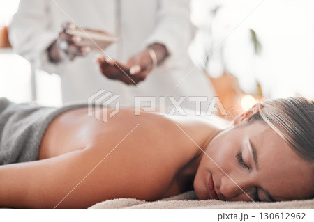 Woman, spa and luxury back massage on table for health, zen and wellness of body. Client with a masseuse for healing, relax and therapy with self care and cosmetic service for detox and holistic time 130612962