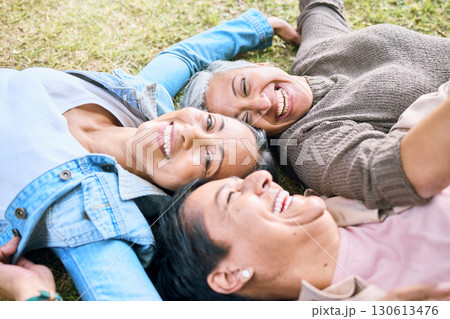 Elderly, happy or friends on grass in a park talking or speaking of funny gossip relaxing holiday vacation in summer. Smile, old people or senior women laughing at a crazy joke or bonding in nature Elderly, happy or friends on grass in a park talking or speaking of funny gossip relaxing holiday vacation in summer. Smile, old people or senior women laughing at a crazy joke or bonding in nature 130613476