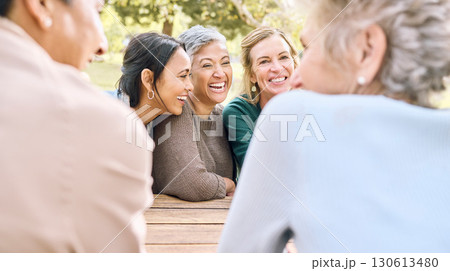 Senior, happy or friends in a park talking or speaking of funny gossip while relaxing holiday vacation in summer. Smile, old people or elderly women laughing at a crazy joke or bonding in nature 130613480