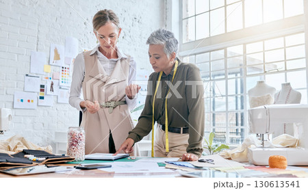 Creative, fashion and designer with business people in workshop studio for manufacturing, planning or idea. Tailor, boutique and retail with women and swatch for ecommerce, production or industry 130613541