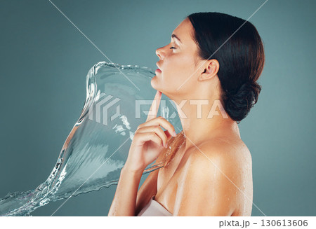 Skin, skincare and water splash on woman body for hygiene and hydration isolated in a studio background. Grooming, shower and female dermatology for young beautiful adult doing self care 130613606