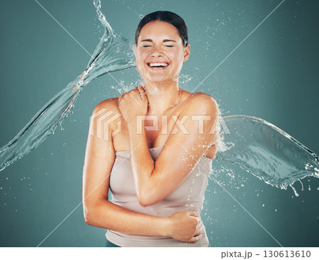 Woman, cosmetics and water splash for wellness, body care and hygiene on studio background. Young female, lady or cleaning for grooming routine, luxury and aesthetic for hydration, healthcare and wet 130613610