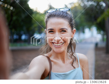 Selfie, young woman and casual in park, walking and smile for fun, balance and happiness. Portrait, female and lady with joy, summer and chilling outdoor, cheerful and freedom on break and weekend Selfie, young woman and casual in park, walking and smile for fun, balance and happiness. Portrait, female and lady with joy, summer and chilling outdoor, cheerful and freedom on break and weekend 130613628