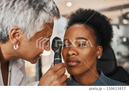 Laser, senior doctor or black woman in eye exam for eyesight at optometrist office. Mature optician helping an African customer or client testing or checking vision, iris or retina visual health Laser, senior doctor or black woman in eye exam for eyesight at optometrist office. Mature optician helping an African customer or client testing or checking vision, iris or retina visual health 130613857