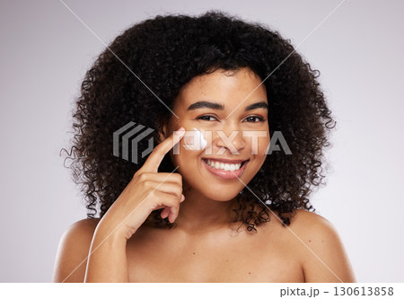 Skincare, cream and portrait of black woman for beauty, wellness and skin health in studio. Dermatology, luxury spa and happy girl with face moisturizer for anti aging, cosmetics and facial treatment Skincare, cream and portrait of black woman for beauty, wellness and skin health in studio. Dermatology, luxury spa and happy girl with face moisturizer for anti aging, cosmetics and facial treatment 130613858