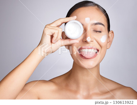 Beauty, container and funny woman face with cream for luxury healthcare, wellness routine or facial acne prevention. Spa salon, dermatology skincare or aesthetic self care model with collagen product 130613922