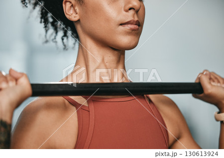 Gym, barbell workout and black woman doing muscle fitness performance for body health, strength training or bodybuilding. Arm exercise, athlete wellness lifestyle and strong bodybuilder weightlifting 130613924