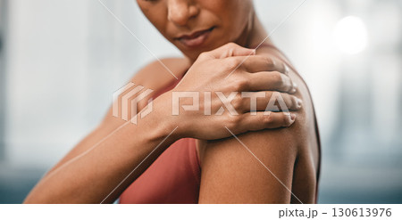 Closeup, fitness and black woman with shoulder pain, muscle ache and strain after training, workout and inflammation. African American lady, female and athlete with sports accident, torn and bruised 130613976