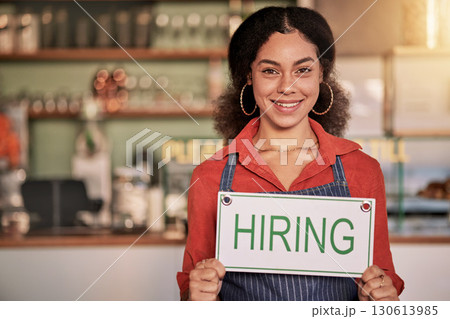 Portrait, small business or black woman with hiring sign for onboarding in a cafe or coffee shop with hospitality. Restaurant manager with a happy smile with recruitment message after opening store 130613985