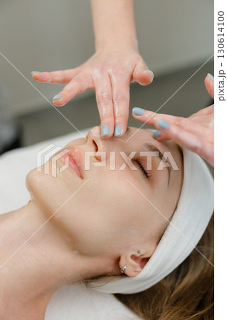 Relaxing Facial Massage at a Spa Treatment Session 130614100
