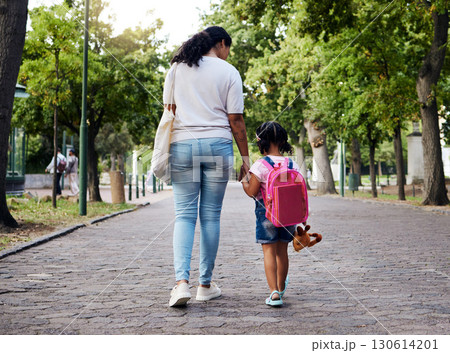 Mother, child and walking with backpack holding hands to school for safety at the outdoor park. Mom with little girl or daughter having a walk together for safe travel, trip or care for childhood Mother, child and walking with backpack holding hands to school for safety at the outdoor park. Mom with little girl or daughter having a walk together for safe travel, trip or care for childhood 130614201