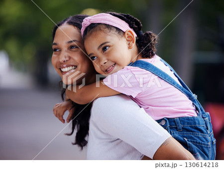Mom, girl child and happy with piggyback ride in urban park, street and outdoor for love, bonding and care. Family, mother and daughter with smile, riding back or happiness on vacation, relax or walk 130614218