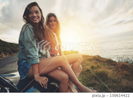 Friends at sunset, women on car with travel to beach, road trip portrait and outdoor with nature and sea holiday. Adventure mockup, freedom and gen z youth on summer vacation, happy with lens flare 130614422