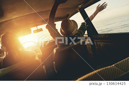 Friends, women and sunset road trip at beach with car, hands and window in air for freedom, celebration or sea. Summer sunshine, vacation and ocean for driving, travel or nature by waves on adventure Friends, women and sunset road trip at beach with car, hands and window in air for freedom, celebration or sea. Summer sunshine, vacation and ocean for driving, travel or nature by waves on adventure 130614425