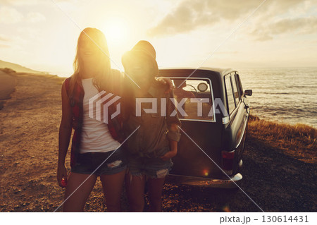 Sunset lens flare with women, car and road trip, travel with friends at beach, outdoor with nature and sea holiday. Transportation, freedom and sunshine on summer vacation, happiness with adventure 130614431