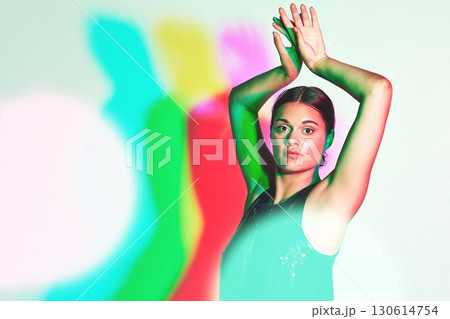Portrait, dance or kaleidoscope and a ballet woman in studio on a white background with a colorful backdrop. Art, music and performance with a female dancer or ballerina on a multicolor wall 130614754