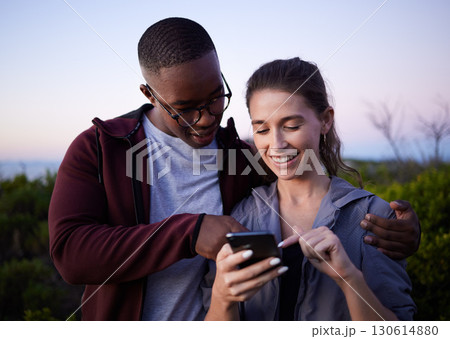 Hiking, travel and couple with phone on mountain for location, gps mobile app and health tracking. Fitness, dating and interracial man and woman with smartphone for adventure, freedom and nature hike 130614880