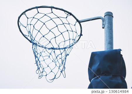 Sports, basketball and netball hoop for training, fitness and a game at school or in public. Rim, play and equipment for a sport in the air for playing, competition and professional match in a park Sports, basketball and netball hoop for training, fitness and a game at school or in public. Rim, play and equipment for a sport in the air for playing, competition and professional match in a park 130614984