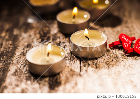 Small candles evenly light up the space around them Small candles evenly light up the space around them 130615158