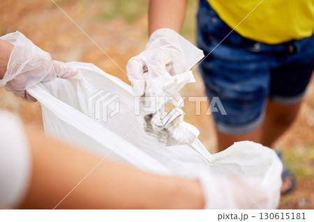 Sustainability, climate change and cleaning trash at a park outdoors by volunteer with litter, pollution or plastic. Environment, earth day and charity activists recycle for the planet and community Sustainability, climate change and cleaning trash at a park outdoors by volunteer with litter, pollution or plastic. Environment, earth day and charity activists recycle for the planet and community 130615181