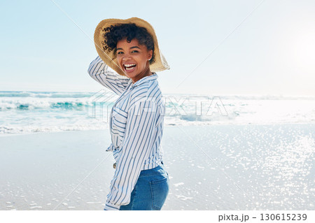 Travel, summer and portrait of black woman at beach on holiday, vacation and weekend by ocean. Happy lifestyle, nature and excited girl laugh, relaxing and enjoying adventure, freedom and fun by sea 130615239