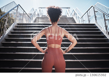 Fitness, woman and stairs for sport in city for running, exercise or healthy cardio preparation. Back of African American female ready for training, workout or sports run for wellness by staircase 130615302