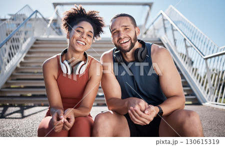 Sports, love and couple on stairs in city on break from exercise workout with smile and headphones. Motivation, health and fitness goals, man and woman rest on New York steps on morning training run. 130615319