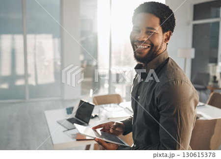Business, portrait and smile of black man with tablet in office for research, internet browsing or web scrolling. Ceo, boss and happy male entrepreneur with technology laughing at meme in company. Business, portrait and smile of black man with tablet in office for research, internet browsing or web scrolling. Ceo, boss and happy male entrepreneur with technology laughing at meme in company. 130615378