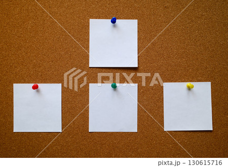Four white blank notes pinned to a cork message board Four white blank notes pinned to a cork message board 130615716