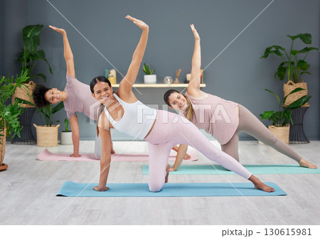 Pregnant, yoga or women in class stretching body for balance, exercise or fitness workout in house living room. Pregnancy, wellness or healthy friends with a happy smile in maternity training at home Pregnant, yoga or women in class stretching body for balance, exercise or fitness workout in house living room. Pregnancy, wellness or healthy friends with a happy smile in maternity training at home 130615981