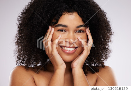 Portrait, beauty and afro with a black woman in studio on a gray background for natural hair treatment. Face, skincare and haircare with an attractive young female model posing to promote cosmetics Portrait, beauty and afro with a black woman in studio on a gray background for natural hair treatment. Face, skincare and haircare with an attractive young female model posing to promote cosmetics 130616129
