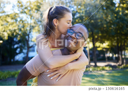 Interracial, piggy back and couple in park, happiness and bonding for romance, loving and smile. Romantic, black man and woman on back, nature and love for relationship, dating and playful together 130616165