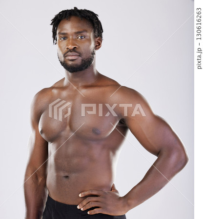 Black man, fitness and portrait of sports person in studio for strong body, muscle and power. Health and wellness of a sexy male bodybuilder model with growth after exercise, workout and training Black man, fitness and portrait of sports person in studio for strong body, muscle and power. Health and wellness of a sexy male bodybuilder model with growth after exercise, workout and training 130616263