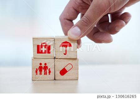 Family, healthcare and hand with blocks for insurance, medical future and investment in health. Medicine, safety and doctor building a hospital plan for security, service and trust in pharmacy 130616265