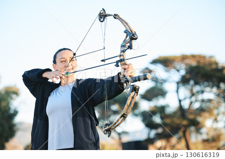 Happy woman, bow or arrows aim in sports field, shooting range or gaming nature in hunting, hobby or exercise. Archery, person or athlete smile with weapon in target training, competition or practice 130616319
