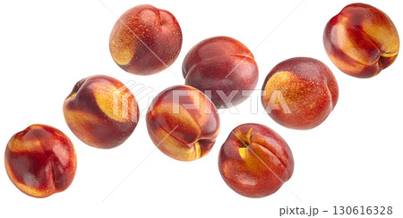 Falling nectarines isolated on white background with clipping path, full depth of field 130616328