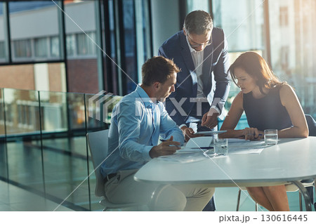 Men, woman and tablet at business meeting in office planning, goals or mission at desk with strategy. Teamwork, touchscreen or leadership for vision, collaboration and coaching in financial company Men, woman and tablet at business meeting in office planning, goals or mission at desk with strategy. Teamwork, touchscreen or leadership for vision, collaboration and coaching in financial company 130616445