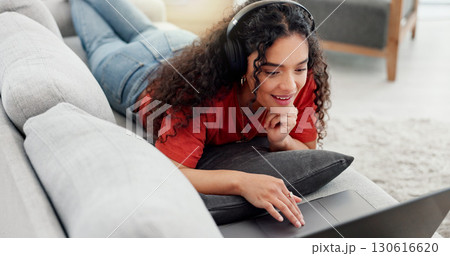 Peace, headphones and laptop with woman on sofa for streaming service, film website or comfortable. Movie subscription, watching series and entertainment with person in living room of home for search 130616620