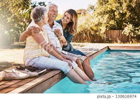 Relax, senior couple and woman with feet in swimming pool enjoying summer holiday, vacation and weekend. Family, love and daughter with elderly parents for bonding, quality time and laughing together 130616974