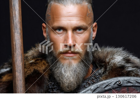 Viking warrior king holding spear and shield on black background 130617206