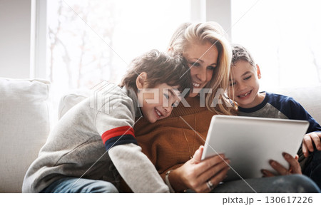 Relax, tablet and mom with children on sofa bonding, quality time and streaming movies on weekend. Love, family home and mom and kids with digital tech for online games, learning and internet app 130617226