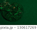 Transparent cosmetic serum drop with bubbles on green background 130617269