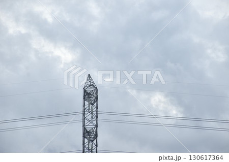 high voltage electric pole on rain cloud sky in evening 130617364