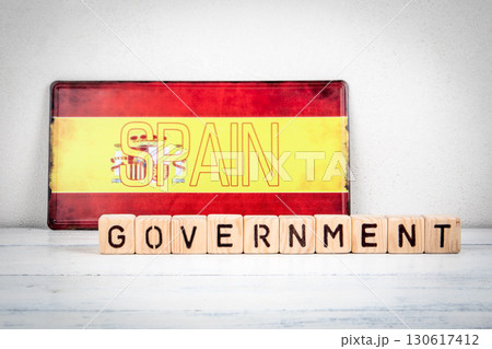 Spain national government authority concept with text and flag background Spain national government authority concept with text and flag background 130617412
