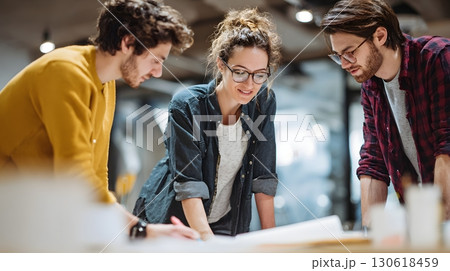 Realistic photo of creative team working on product prototype in studio Realistic photo of creative team working on product prototype in studio 130618459