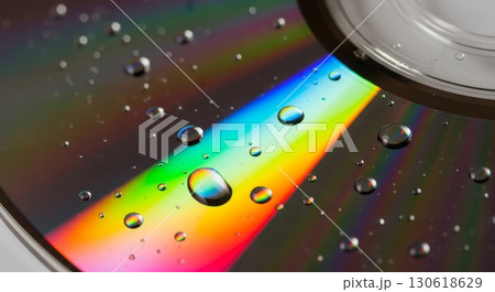Rainbow Light Spectrum with Water Droplets on Reflective Surface 130618629