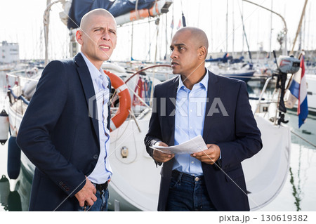 men in suits buy and sell a yacht in the seaport men in suits buy and sell a yacht in the seaport 130619382