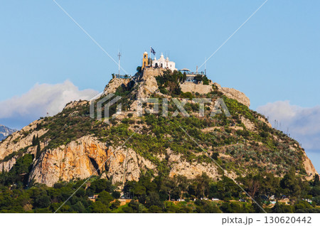 Lycabettus Hill with Saint George church and Greek flag in Athens, Greece. Lycabettus Hill with Saint George church and Greek flag in Athens, Greece. 130620442