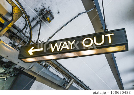 Way Out Exit Sign with Left Arrow in Underground Metro Station 130620488